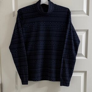 Uniqlo extra soft and light turtle neck with a blue Aztec Pattern